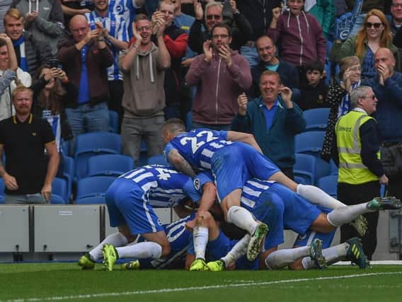 Brighton players celebrate Pascal Gross' opener. Picture by Phil Westlake (PW Sporting Photography)