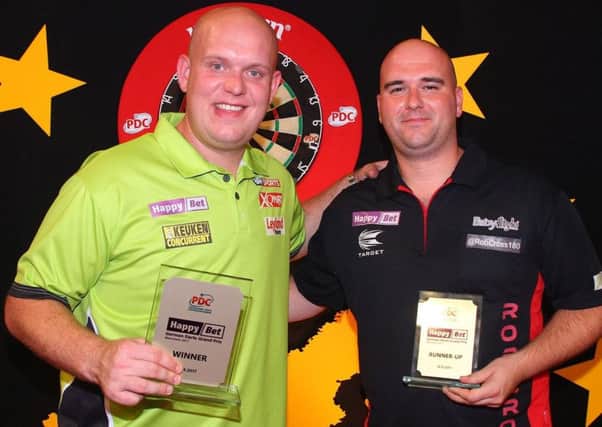 Rob Cross (right) with Michael van Gerwen at the conclusion of the German Darts Grand Prix. Picture courtesy PDC Europe