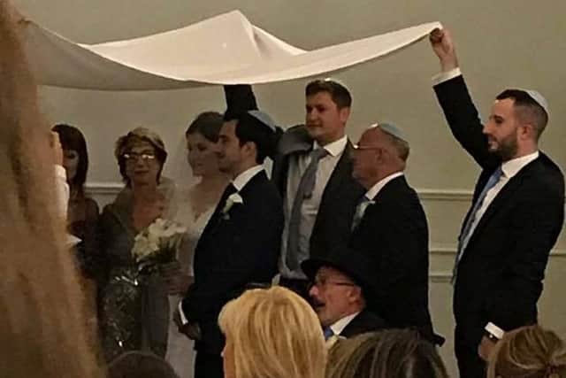 Friends helped out to make a make-shift 'chuppah' at the Metropole