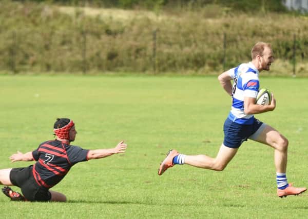 Tom Waring dashes clear of a despairing Park House tackle to score a try. Picture courtesy Jon Smalldon