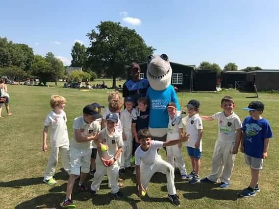 Sussex player Jofra Archer and mascot Sid the Shark make new friends at one of the SCF Cup qualifying hubs