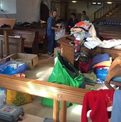 Volunteers sorting through the many donations at Itchenor Church