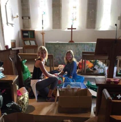 Volunteers sorting through the many donations at Itchenor Church