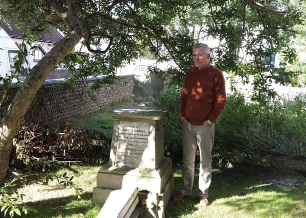 Christ Church warden Kenneth Hobbs with the vandalised 140-year-old gravestone
