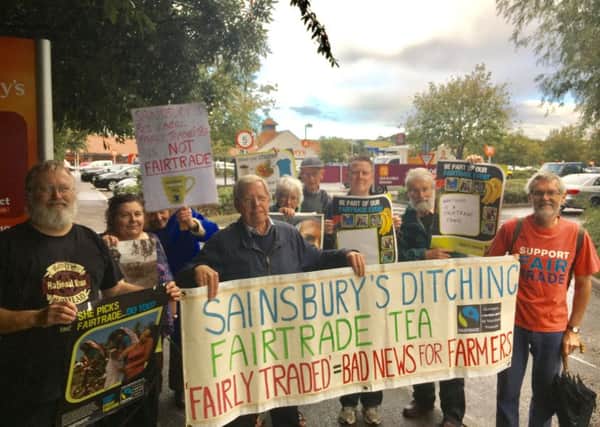Members of the Worthing Fairtrade Town group outside Sainsbury's in Lyons Farm retail park. Holding the banner is (left) Dereck Prentis, 71, and (right) Richard Battson, 70