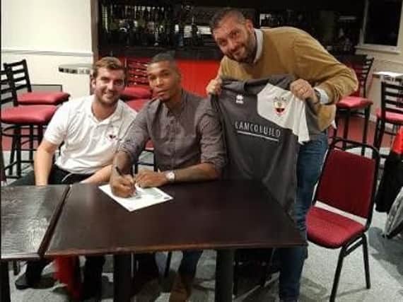Marcus Bent (centre) with Wick manager Lee Baldwin (left) and chairman Rodney Lampton (right)