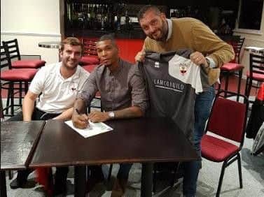 Marcus Bent (centre) with Wick manager Lee Baldwin (left) and chairman Rodney Lampton (right)