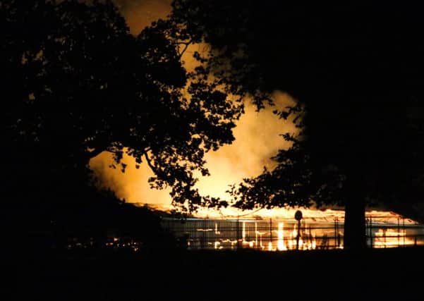 Six fire crews have spent the evening battling a blaze at a farm after 1000 hay bales caught fire. Photo by Eddie Mitchell