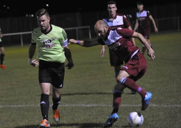 Russell Eldridge on the ball during Little Common's abandoned game against Ringmer on Tuesday night. Picture by Simon Newstead
