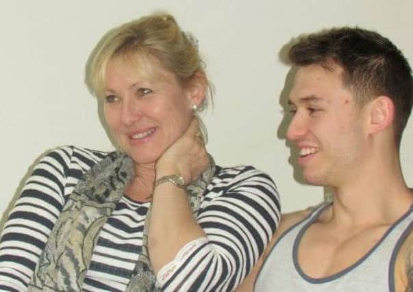 Matt Collino and his mum Debbie, who wants youngsters to get the free vaccine