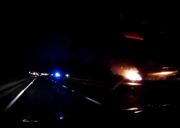 The car had burst into flames. SUS-170915-115943001