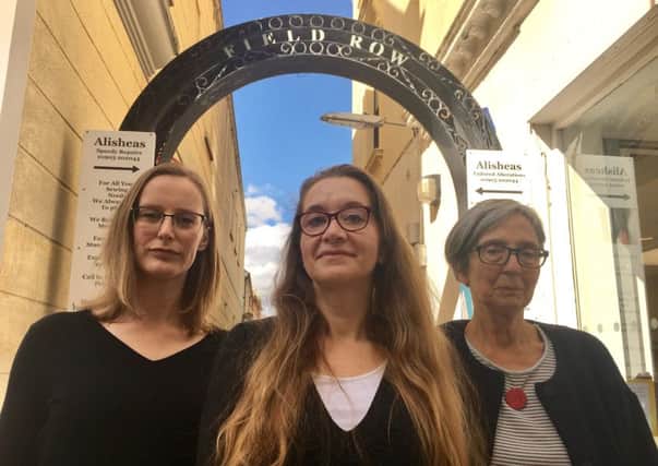 (Left to right): Business owners Wendy Gwynn, Alishea Foreman and Min Cooper in front of the archway in Field Row, Worthing