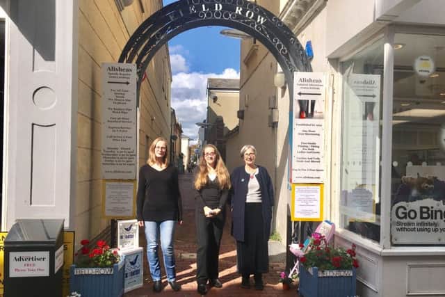 (Left to right): Business owners Wendy Gwynn, Alishea Foreman and Min Cooper in front of the archway in Field Row, Worthing