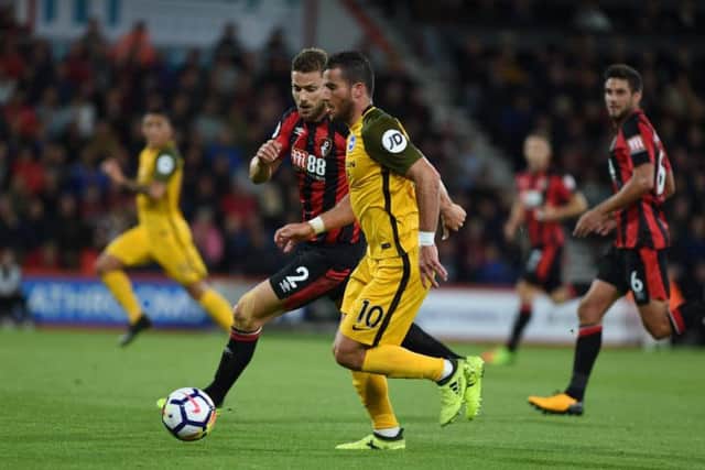 Brighton & Hove Albion striker Tomer Hemed and Bournemouth captain Simon Francis. Picture by PW Sporting Pics