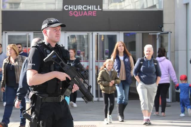 An armed officer in Churchill Square, Brighton. Picture by Eddie Mitchell
