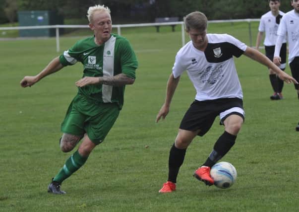 Bexhill United midfielder Ryan Harffey on the ball against Mile Oak. Pictures by Simon Newstead