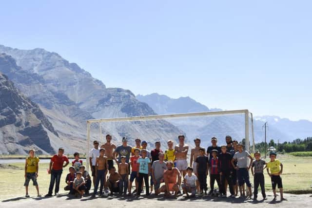 A whole village near the Pamir Highway in Tajikistan turns out for a big game of football