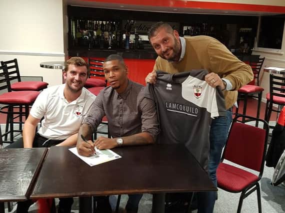 Marcus Bent (centre) with Wick boss Lee Baldwin (left) and chairman Rodney Lampton at Crabtree Park last Tuesday.