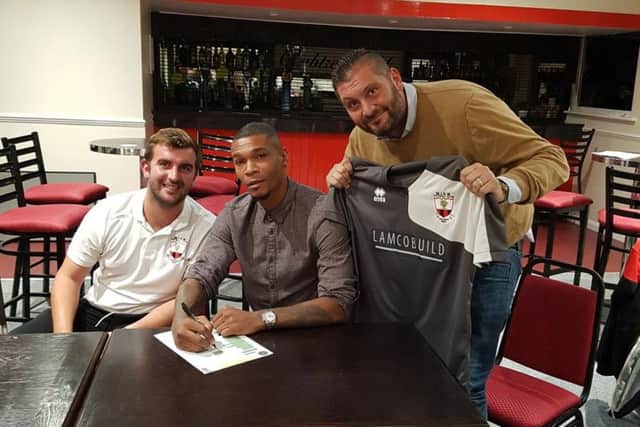 Marcus Bent (centre) with Wick boss Lee Baldwin (left) and chairman Rodney Lampton at Crabtree Park last Tuesday.