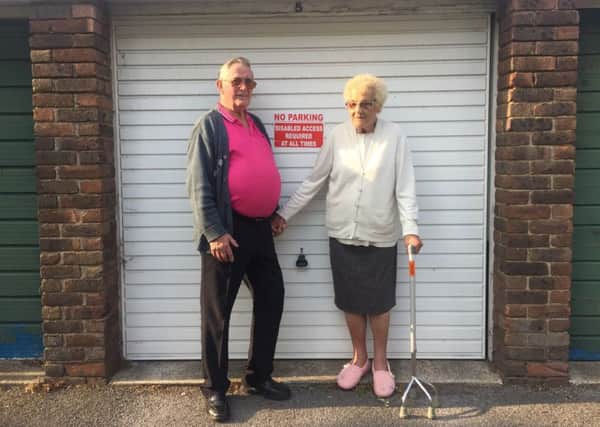George and Lilian Goodbody next to their garage at Aston House in Shoreham