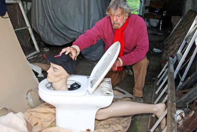 Alan McKay and his toilet art project. Photo by Derek Martin Photography