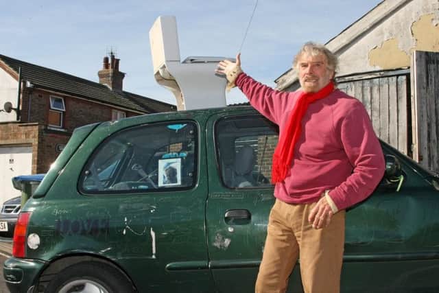 Alan McKay and his toilet art project on his car. Photo by Derek Martin Photography
