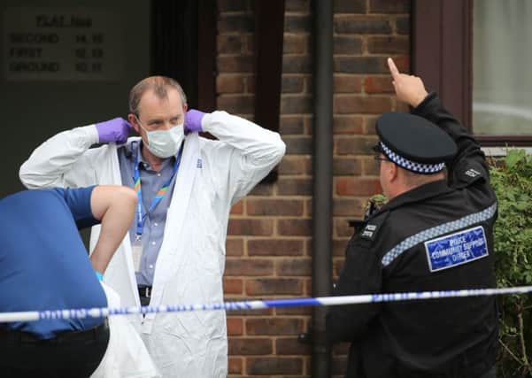 Forensic teams at the scene. Picture: Eddie Mitchell