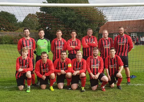 Petworth FC's 2017-18 line-up in their newly-sponsored kits