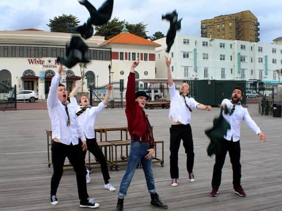 Cast members from Our House pictured on Hastings Pier. Photo by Ian Gillam.