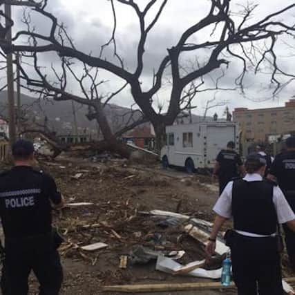 Police officers from Surrey and Sussex are carrying out valuable work to support local colleagues and residents in the hurricane-hit British Virgin Islands (BVI). Picture: Sussex Police