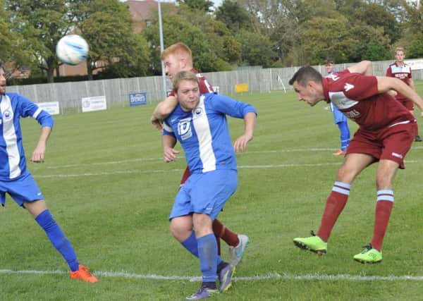 Lewis Parsons heads for goal at a Little Common corner. Pictures by Simon Newstead