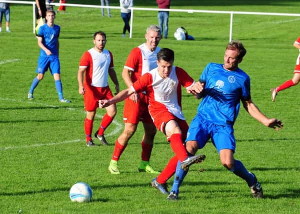 Action rom Midhurst's FA Cup debut, which ended in defeat to United Services / Picture by Kate Shemilt