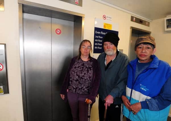 Paul Cairns (centre) was unable to leave his partner Daniellas (right) flat for days. Pictured with fellow Cambourne Court resident Shireen Hannam (left). Picture: Kate Shemilt