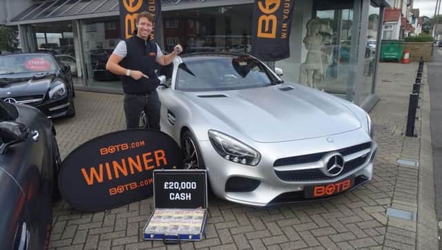 Best of the Best's Christian Williams poses with the silver Mercedes