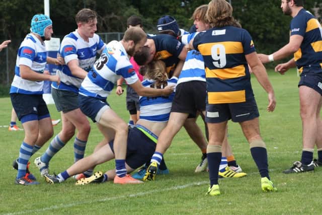 Hastings & Bexhill and Old Williamsonians tussle for possession. Picture courtesy Karen Walker