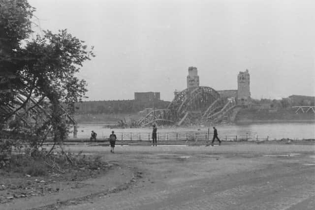 The remains of Cologne's main Hohenzollern railway bridge over the Rhine. (Destroyed by German military engineers on 6th March 1945). SUS-170925-145615001