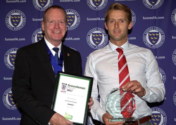 Andy Probee, right, receives his award from Sussex FA's Mathew Major