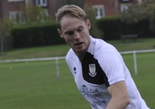 Bexhill United forward Drew Greenall caused problems for the Cobham defence.