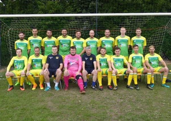 Westfield Football Club's first team squad line up for the camera prior to Saturday's game against Bosham.