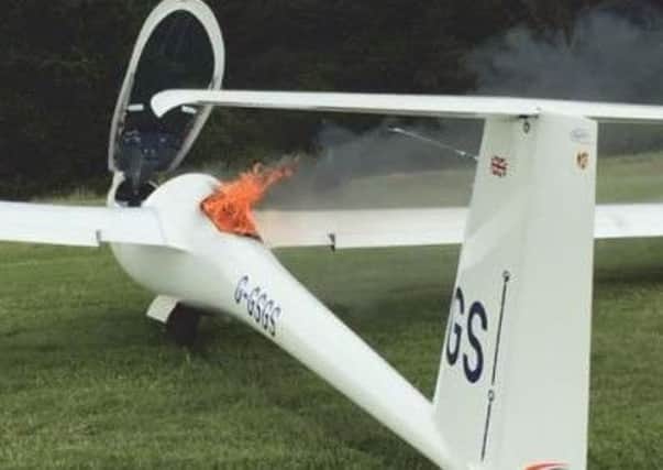 A fire breaking out of the battery compartment of a sailplane. Picture supplied by the Air Accident Investigation Branch