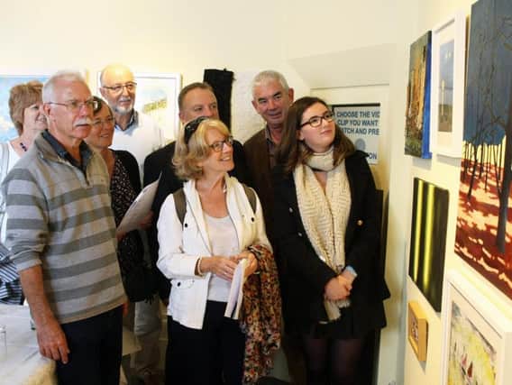 Visitors enjoy the exhibition