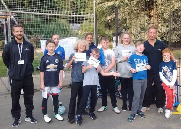 Simone Brookes (second from right) and  yougsters with their Young Leader Award certificates at  Alexandra Park