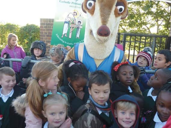 Piers the Meerkat with children at St Joseph's for Walk to School Month