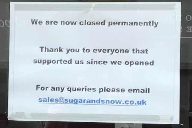 Sign stating Sugar and Snow has 'permanently closed'