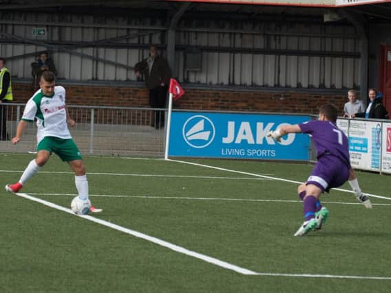 Ollie Pearce scores Bognor's second goal at Eastbourne Borough / Picture by Tommy McMillan