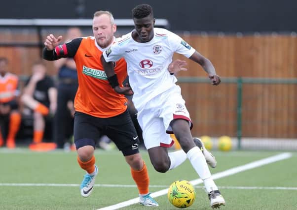 Ansu Janneh on the ball during Hastings United's 2-1 defeat at Walton Casuals on Saturday. Picture courtesy Scott White
