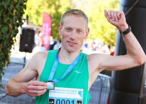 James Baker is first over the line in the 2016 Half Marathon / Picture by Derek Martin