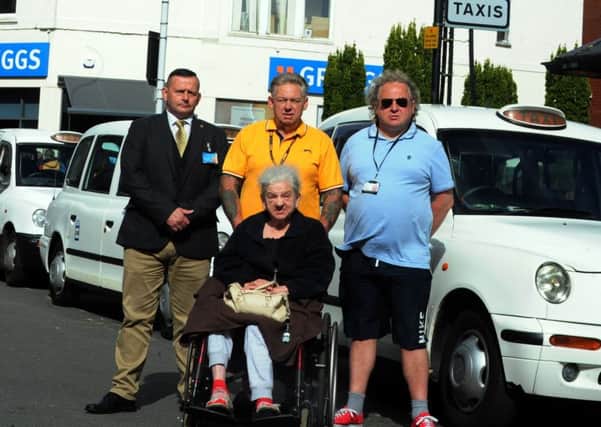 Taxi drivers Daniel France and Trevor Goss with Chris Cooper of Castlegate Security Solutions (left) and cab user Shirley Cable
