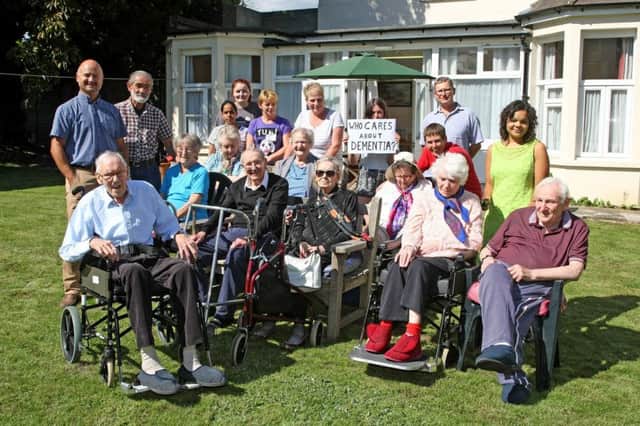 DM17840386.jpg Community unites to save Whyke Lodge care home, Chichester, from becoming housing. Staff, residents and relatives outside the home. Photo by Derek Martin; SUS-170815-200239008
