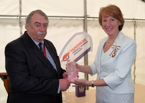 The Lord Lieutenant of West Sussex, Susan Pyper, handing award to the museums chairman, group captain David Baron
